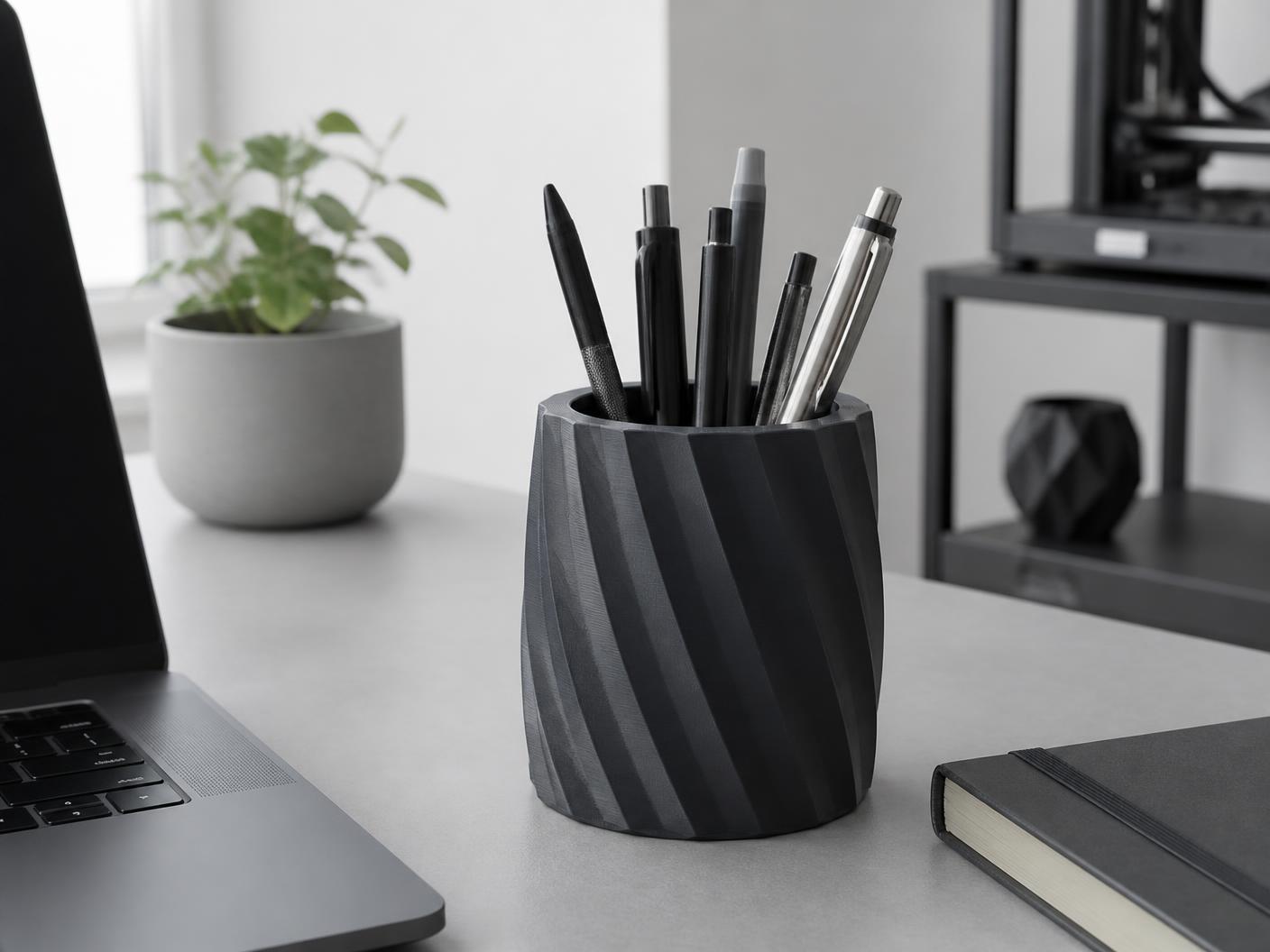A 3D-printed PLA pen holder on a tidy workspace